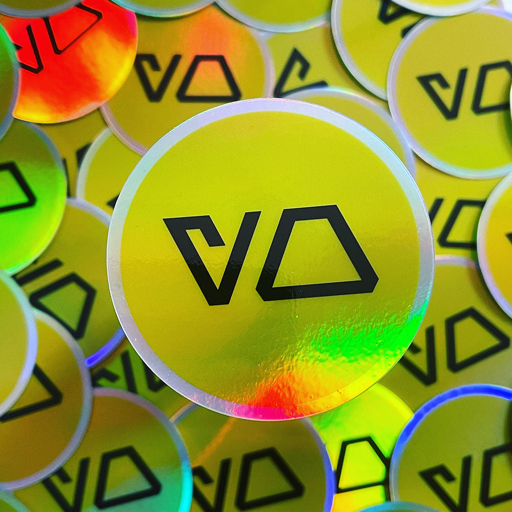 3" round sticker printed on holographic vinyl with Yo written in black Aurebesh on yellow background